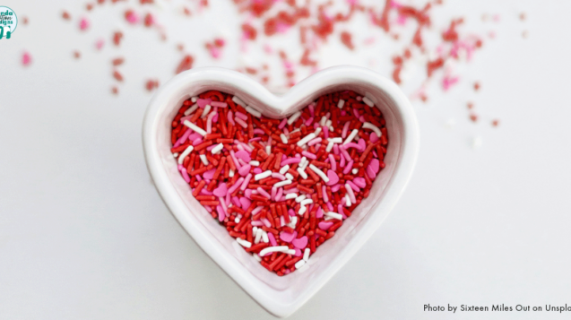 Heart shaped bowl filled with red, pink and white sprinkles